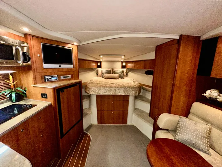 Tarpon III Yacht Photos Pics Luxurious interior of 2009 Cruisers Yachts 360 Express with cozy bed and modern amenities.