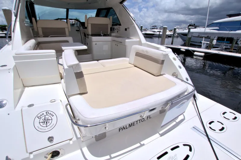 Sun Daze Yacht Photos Pics 2013 Sea Ray 450 Sundancer yacht with spacious seating at a marina in Palmetto, Florida.