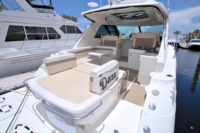 Sun Daze Yacht Photos Pics 2013 Sea Ray 450 Sundancer yacht with spacious deck and seating area.