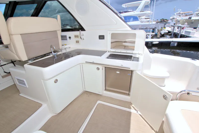 Sun Daze Yacht Photos Pics Luxurious 2013 Sea Ray 450 Sundancer yacht interior with kitchenette and seating area.