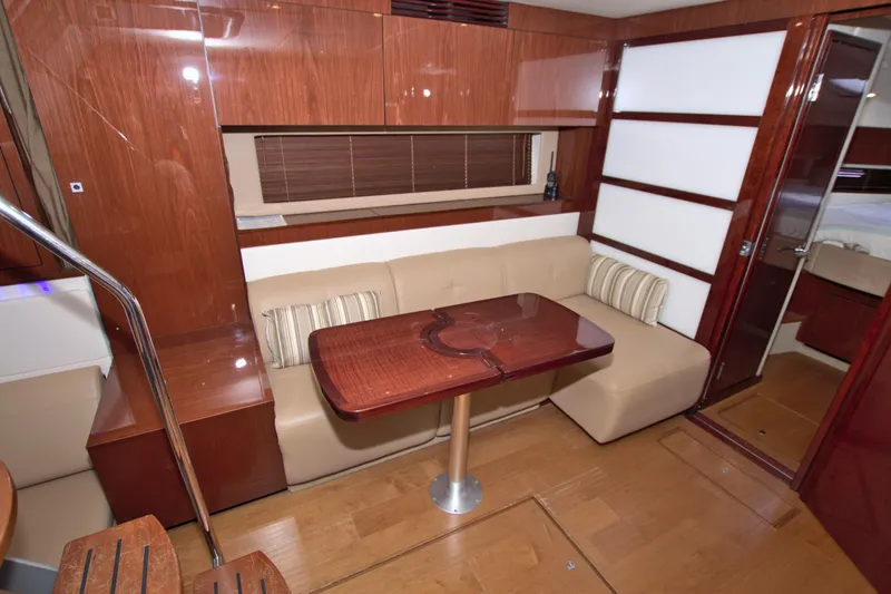 Sun Daze Yacht Photos Pics Luxurious interior of 2013 Sea Ray 450 Sundancer yacht with wooden finishes and cozy seating.