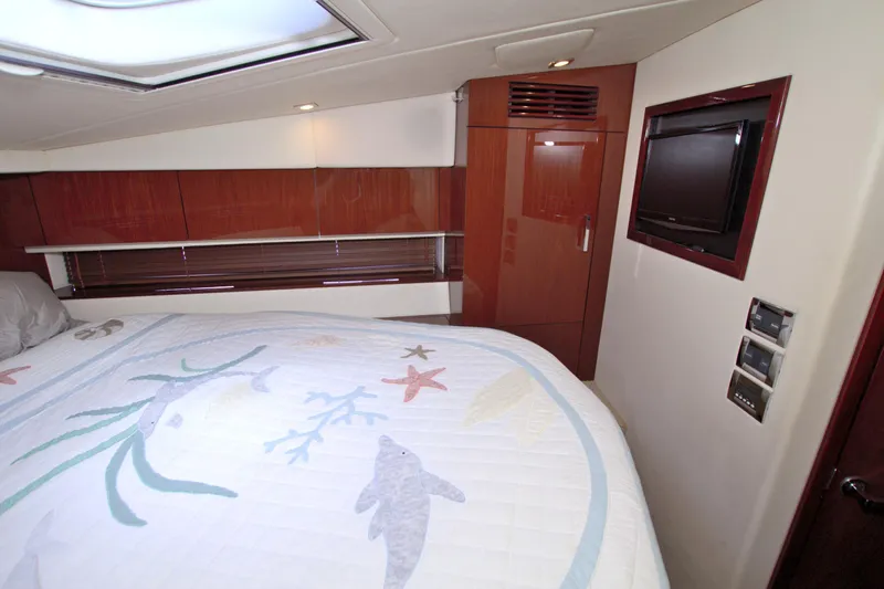 Sun Daze Yacht Photos Pics Luxurious cabin interior of 2013 Sea Ray 450 Sundancer yacht with elegant wood finishes.