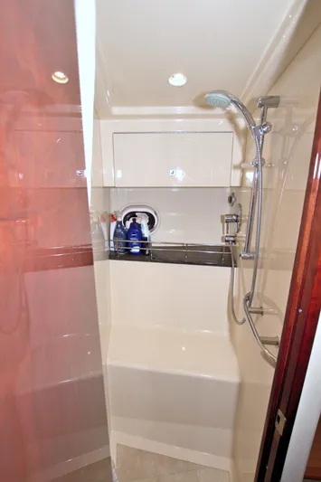 Sun Daze Yacht Photos Pics Shower area in 2013 Sea Ray 450 Sundancer yacht, featuring modern fixtures and storage space.