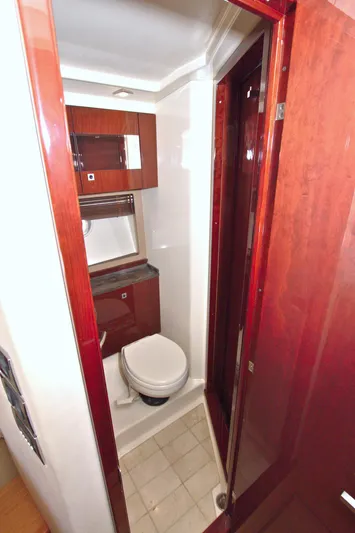 Sun Daze Yacht Photos Pics Luxurious bathroom in 2013 Sea Ray 450 Sundancer yacht with wood accents and modern fixtures.