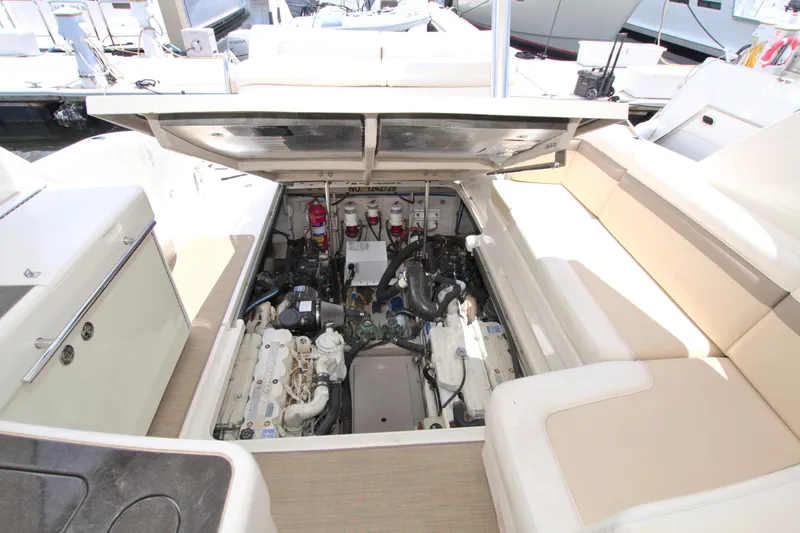 Sun Daze Yacht Photos Pics Engine compartment of a 2013 Sea Ray 450 Sundancer yacht, showcasing mechanical components.
