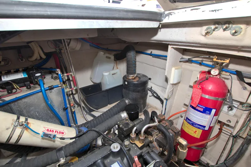 Sun Daze Yacht Photos Pics Engine compartment of 2013 Sea Ray 450 Sundancer with fire extinguisher and gas flow system.