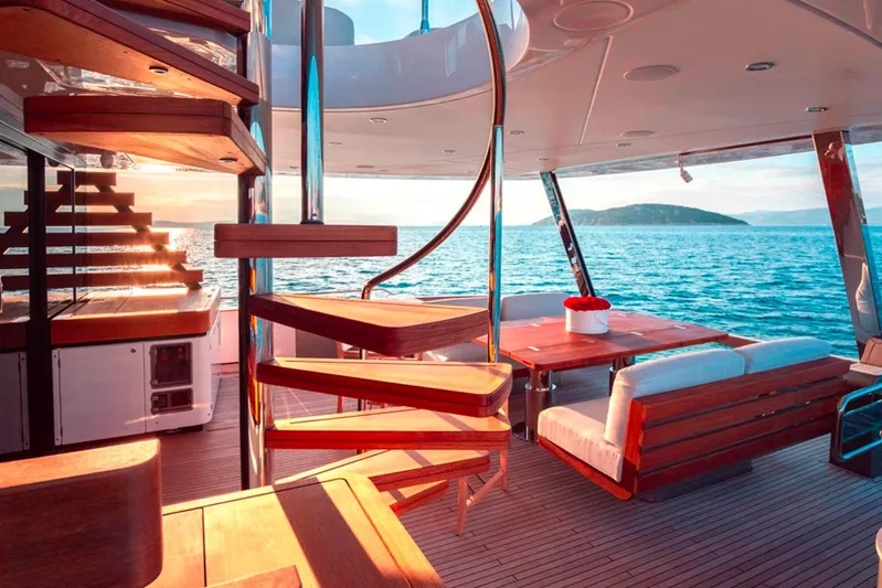  Yacht Photos Pics Luxurious 2025 Azimut Magellano 25M yacht interior with spiral staircase and ocean view.