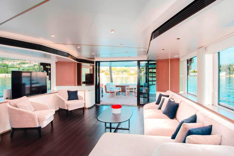  Yacht Photos Pics Luxurious interior of 2025 Azimut Magellano 25M yacht with elegant seating and panoramic windows.