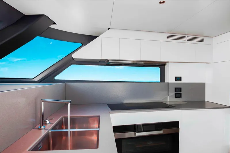  Yacht Photos Pics Modern kitchen interior of 2025 Azimut Magellano 25M yacht with sleek design and ocean view.