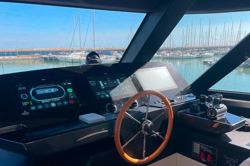  Yacht Photos Pics Helm of 2025 Azimut Magellano 25M yacht with modern controls and marina view.