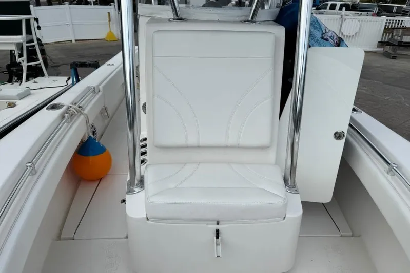  Yacht Photos Pics 2025 Contender 25 Tournament boat interior with white seating and stainless steel accents.