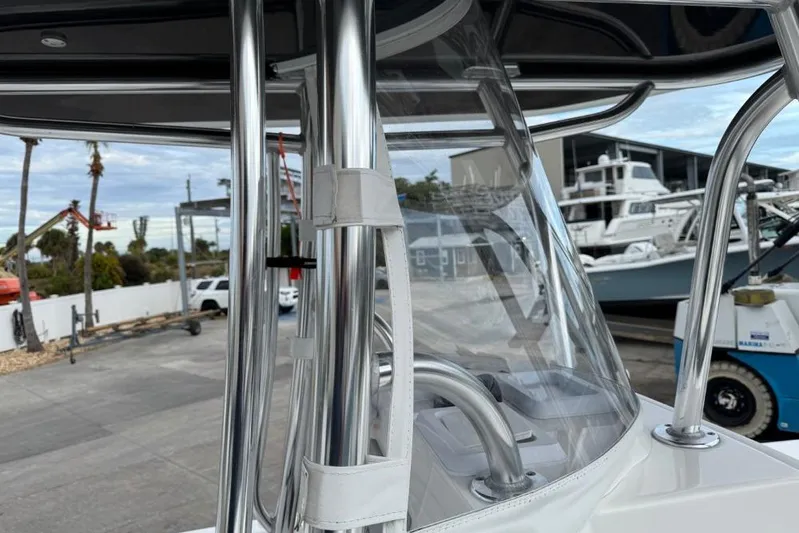  Yacht Photos Pics 2025 Contender 25 Tournament boat with sleek metal framework and clear windshield.