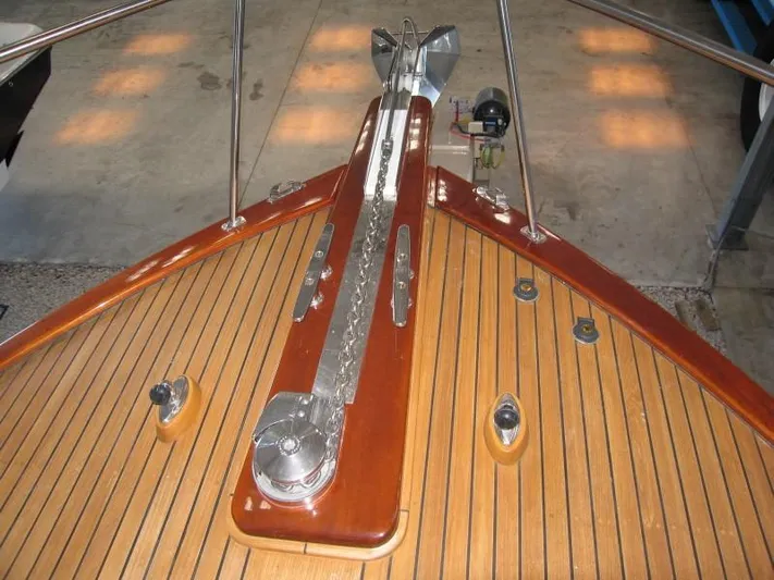 Miss Osb Yacht Photos Pics Bow of 2009 Hugh Saint 65 Commuter boat with polished wood and metal details.