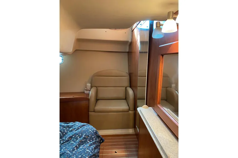  Yacht Photos Pics Interior of 2010 Hunter 45 Deck Salon yacht with seating and wooden cabinetry.