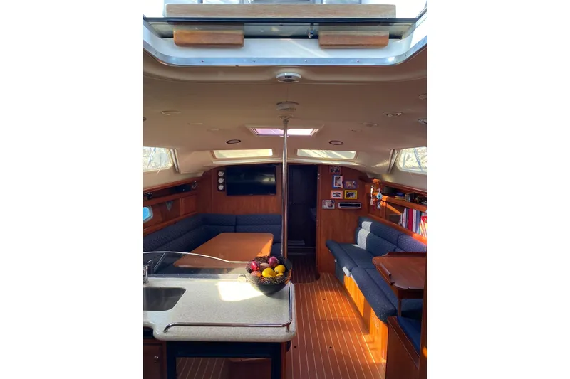  Yacht Photos Pics Interior of 2010 Hunter 45 Deck Salon yacht with cozy seating and modern amenities.