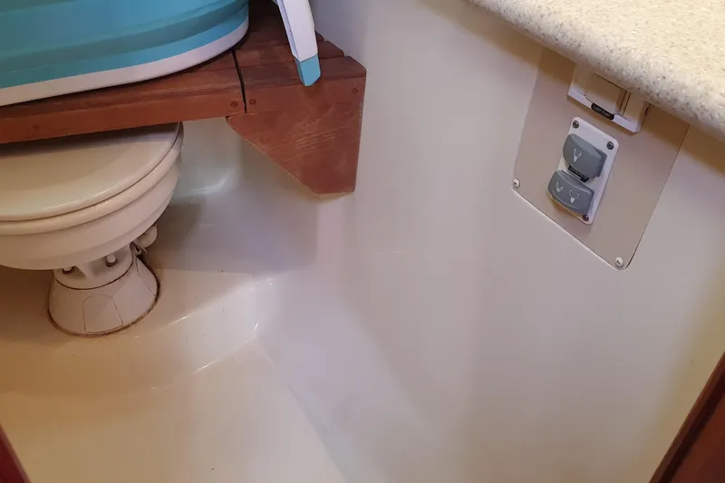  Yacht Photos Pics 2010 Hunter 45 Deck Salon bathroom with toilet and control panel.