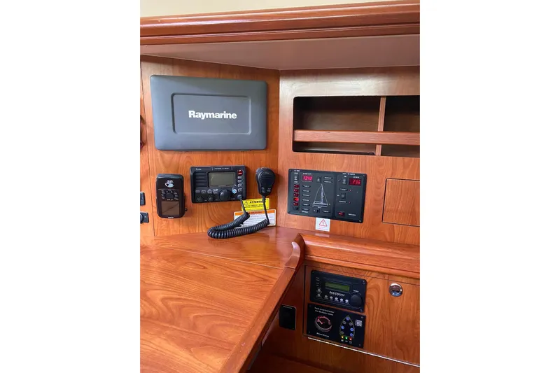  Yacht Photos Pics Control panel of 2010 Hunter 45 Deck Salon with Raymarine equipment.
