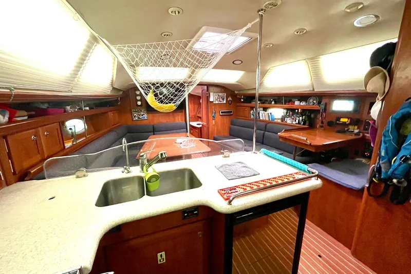  Yacht Photos Pics Interior of 2010 Hunter 45 Deck Salon yacht with modern kitchen and seating area.