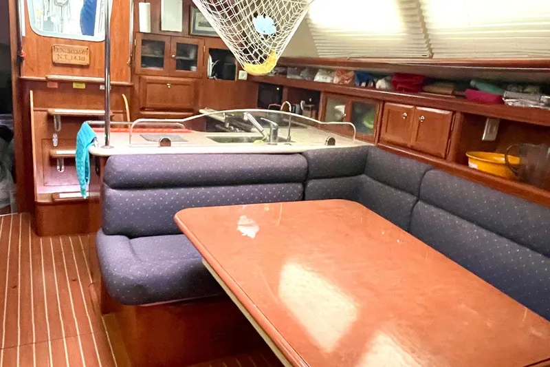  Yacht Photos Pics Interior of 2010 Hunter 45 Deck Salon with dining area and kitchen.