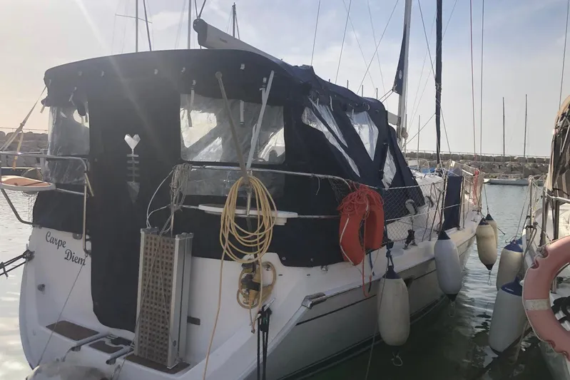  Yacht Photos Pics Sailboat Hunter 45 Deck Salon 2010 docked, featuring protective covers and safety equipment.