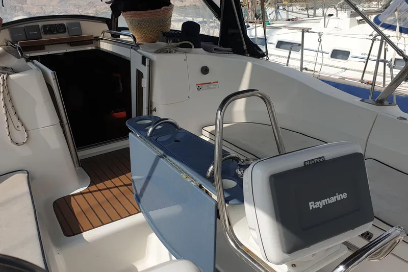  Yacht Photos Pics Interior view of 2010 Hunter 45 Deck Salon sailboat cockpit with Raymarine navigation system.