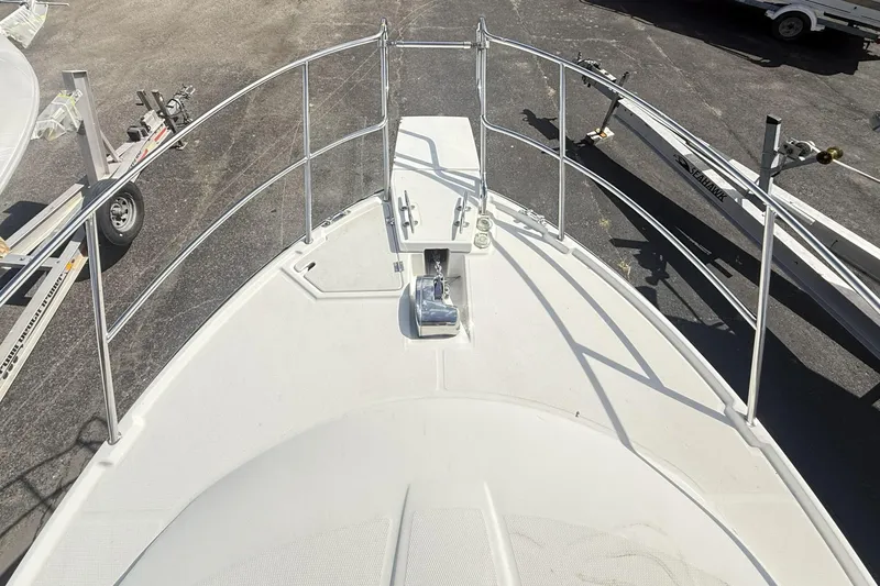  Yacht Photos Pics 2012 Cutwater C-28 boat bow with railing and anchor, parked on a trailer.