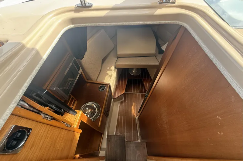  Yacht Photos Pics 2012 Cutwater C-28 cabin interior with wood finish and compact layout.