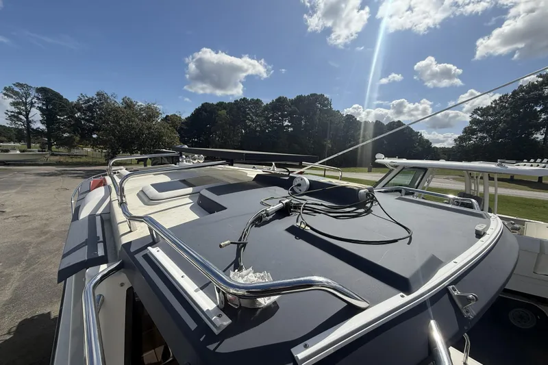  Yacht Photos Pics 2012 Cutwater C-28 boat deck under sunny sky with trees in background.