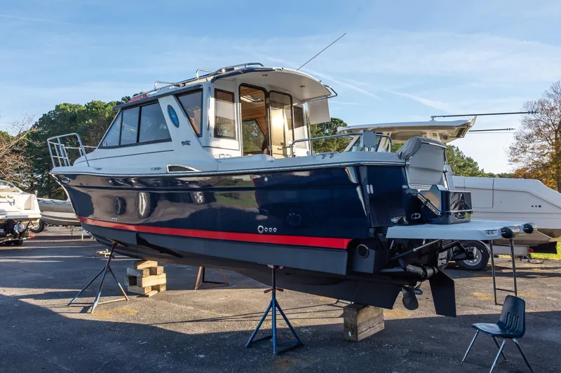  Yacht Photos Pics 2012 Cutwater C-28 boat on stands, blue hull, outdoor display.