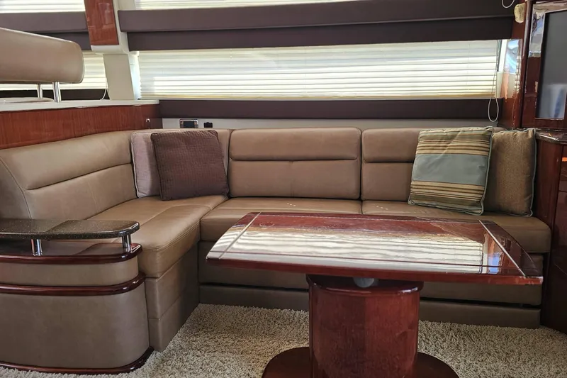  Yacht Photos Pics Luxurious interior of 2012 Meridian 441 yacht with plush seating and elegant wood finishes.