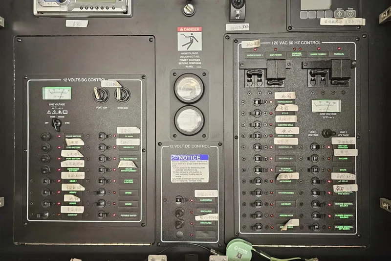  Yacht Photos Pics Electrical control panel of a 2012 Meridian 441 yacht with labeled switches and gauges.