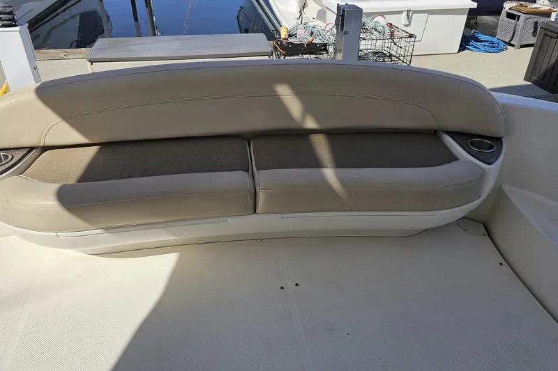  Yacht Photos Pics 2012 Meridian 441 boat seating area with beige cushions and cup holders.