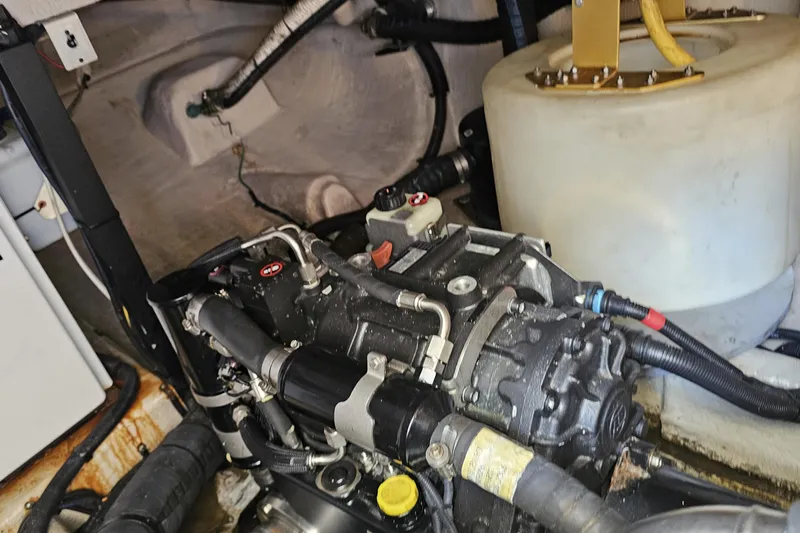  Yacht Photos Pics Engine compartment of a 2012 Meridian 441 boat, showcasing mechanical components and wiring.