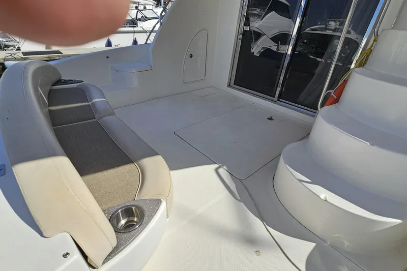  Yacht Photos Pics 2012 Meridian 441 yacht interior with seating and stairs, featuring modern design elements.