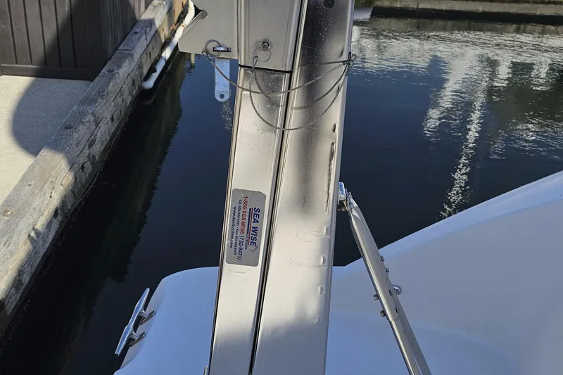  Yacht Photos Pics Boat davit system on a 2012 Meridian 441, docked by the water.