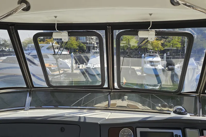  Yacht Photos Pics View from 2012 Meridian 441 yacht cockpit overlooking marina with docked boats.