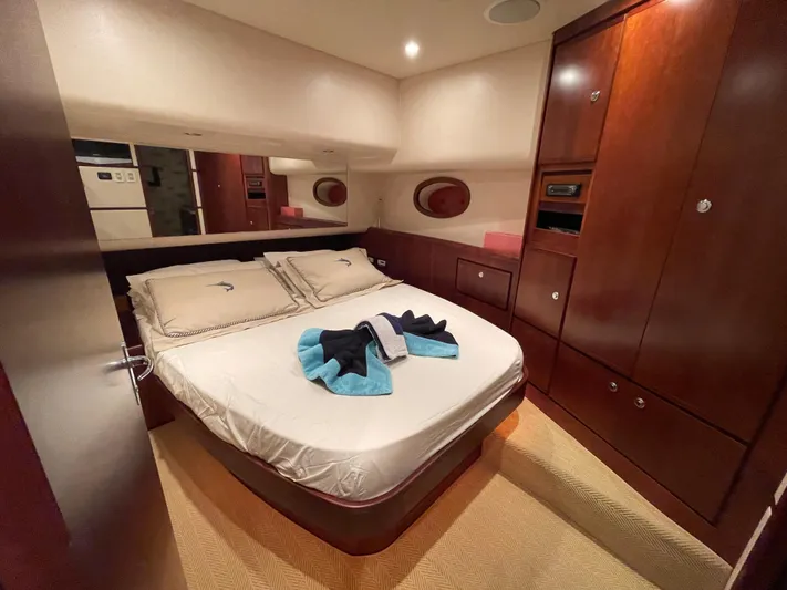  Yacht Photos Pics Luxurious cabin interior of a 2005 Bertram 510 yacht with elegant wood finishes.