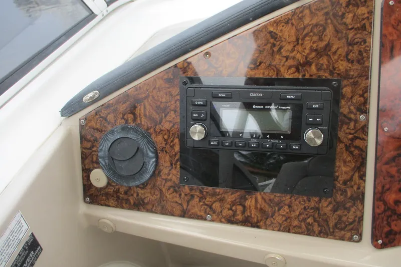  Yacht Photos Pics 2006 Carver 466 Motor Yacht dashboard with Clarion audio system and wood paneling.