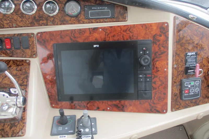  Yacht Photos Pics Control panel of 2006 Carver 466 Motor Yacht with navigation screen and gauges.
