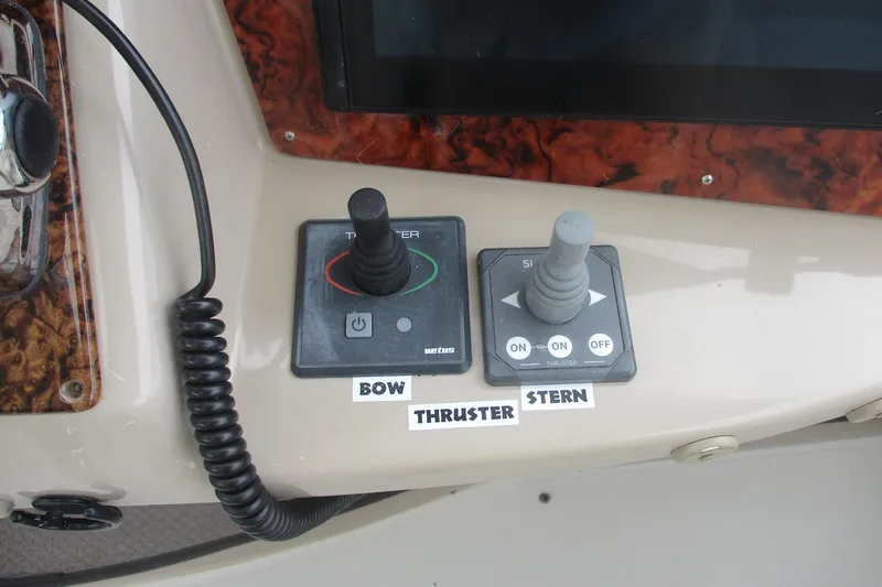  Yacht Photos Pics Control panel of 2006 Carver 466 Motor Yacht with bow and stern thruster joysticks.