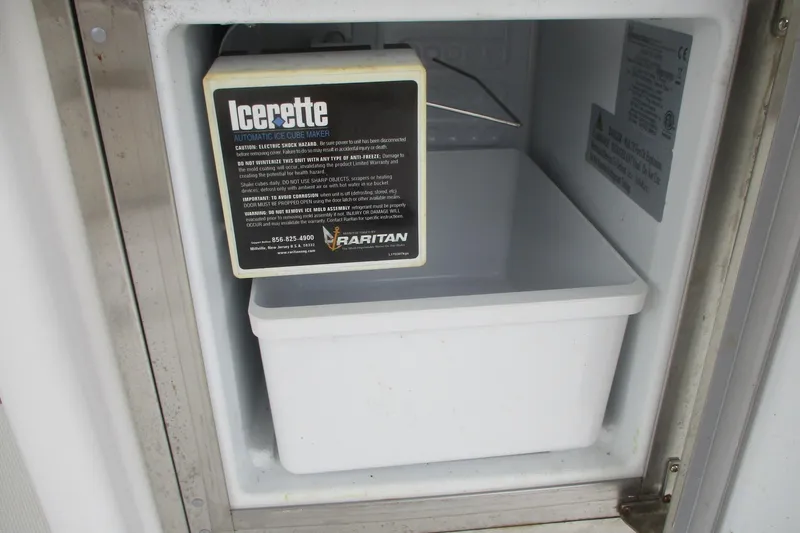  Yacht Photos Pics Ice maker inside 2006 Carver 466 Motor Yacht, featuring Raritan Icerette automatic ice cube maker.