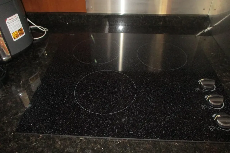  Yacht Photos Pics Glass cooktop on 2006 Carver 466 Motor Yacht kitchen counter.