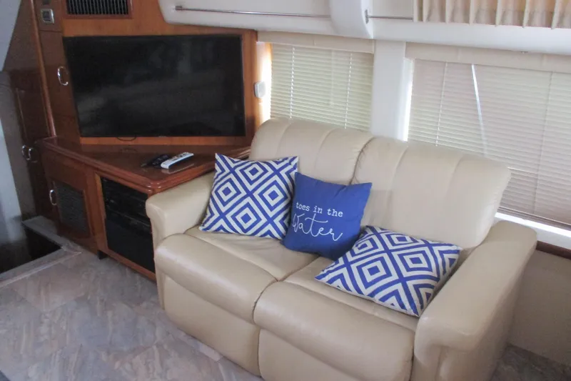  Yacht Photos Pics Interior of 2006 Carver 466 Motor Yacht with beige sofa and decorative pillows.