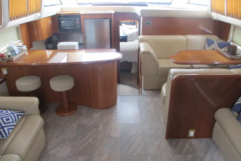  Yacht Photos Pics Luxurious interior of 2006 Carver 466 Motor Yacht with elegant seating and dining area.