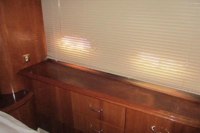  Yacht Photos Pics Interior of 2006 Carver 466 Motor Yacht with wooden cabinetry and blinds.