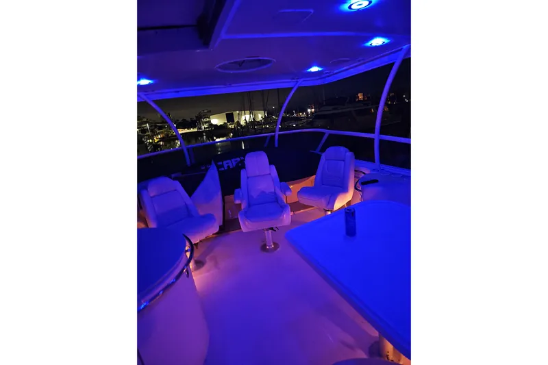  Yacht Photos Pics 2006 Carver 466 Motor Yacht interior with blue ambient lighting at night.