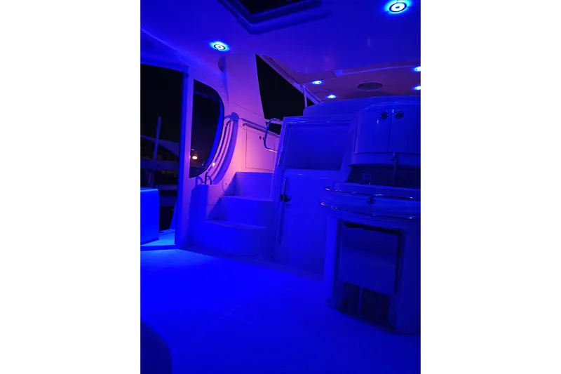  Yacht Photos Pics 2006 Carver 466 Motor Yacht interior with blue LED lighting at night.