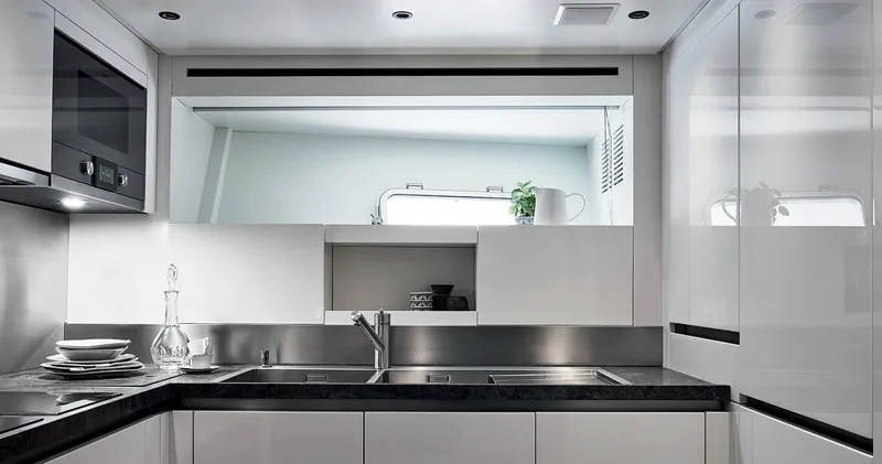  Yacht Photos Pics Modern kitchen in 2022 Sanlorenzo SX 88 yacht with sleek white cabinetry.
