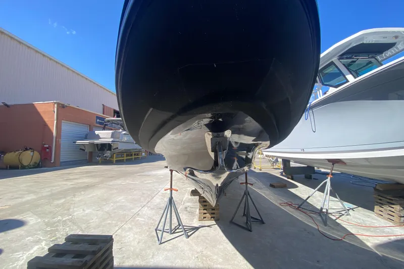  Yacht Photos Pics 2018 Bernico RX 10 boat on stands in a shipyard under clear blue sky.