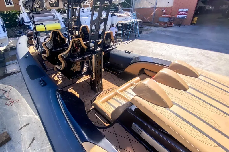  Yacht Photos Pics 2018 Bernico RX 10 boat interior with luxury seating and sleek design in a marina setting.